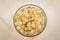 Full glass of currant/full glass of currant on a white marble background, top view