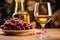 a full glass of dessert wine placed next to a bowl of cherries