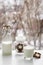 Full glass of milk, chocolate cookies and a bottle on breakfast table on window view