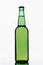 Full green bottle on white background.