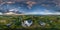 full hdri 360 panorama aerial view of orthodox temple or defense church in countryside with evening sky and sunset clouds in