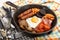 Full irish breakfast in a cast iron pan