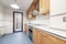 full kitchen with white wood countertops with cherry wood cabinets