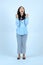 full leght shoot of happy asian Indonesian woman wearing casual attire on isolated background