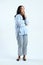 full leght shoot of pensive asian indonesian woman on isolated background