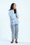 full leght shoot of pensive asian indonesian woman on isolated background