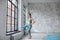 Full lengh sporty yoga girl with yoga mat in sport club studio