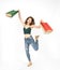 Full length attractive beauty young shopaholic asian woman in green sexy shirt and jean hand hold shopping bag jump with smile ,