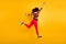 Full length back rear profile side photo of cheerful crazy dark skin teenager girl jump run after spring sales discounts