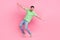 Full length body photo of carefree traveler funny guy standing tiptoes flying wings overjoyed emotions isolated on pink