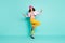 Full length body size photo of cheerful positive side profile cute fun girl wearing yellow trousers pants smiling