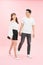 Full length body size photo of couple walking streets of town they have just arrived in while isolated with pastel background