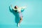 Full length body size photo of crazy female dancer singing laughing loudly moving at party isolated on bright teal color