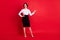 Full length body size photo curious business woman showing finger copyspace isolated vibrant red color background