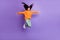 Full length body size photo of girl jumping hands like wings childish looking blank space isolated on bright purple