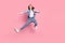 Full length body size photo girl jumping practising martial arts karate isolated pastel pink color background