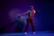 Full length body size photo guy overjoyed dancing party in night club keeping disco ball isolated violet color