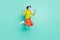 Full length body size photo of jumping high woman keeping smartphone gesturing like winner isolated vivid teal color
