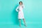 Full length body size photo serious female doctor wearing white uniform spectacles isolated vivid teal color background