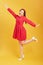 Full length body size photo of turned charming excited careless nice cute girl isolated over yellow background