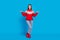 Full length body size photo woman in red pullover smiling comparing empty spaces on hand isolated vivid blue color