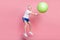 Full length body size side profile photo senior man jumping up throwing fit ball isolated pastel pink color background