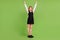 Full length body size view of attractive cheerful girl rising hands up success score  over green color