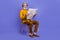 Full length body size view of attractive cheerful gray-haired man reading page  over bright violet purple color