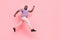 Full length body size view of attractive cheerful guy jumping running flight isolated over pink pastel color background