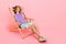 Full length body size view of attractive dreamy serene guy sitting in chair spending weekend isolated over pink pastel