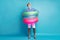 Full length body size view of his he funky guy tourist get inside colorful rubber lifebuoys pool sea ocean wear safety