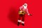 Full length body size view of his he handsome cheerful bearded fat overweight Santa vocalist soloist playing guitar
