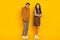 Full length body size view of nice cheerful funky couple first meet unsure guy flirting isolated on bright yellow color
