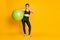 Full length body size view of nice sportive cheerful girl carrying fitness ball showing thumbup isolated over bright