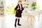 Full length body size view photo lovely charming cute kid hold hand snack ready get knowledge black jacket she her skirt