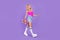 Full length body size view of pretty graceful cheerful girl carrying skate going isolated over vivid purple violet color