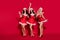 Full length body size view of three pretty cheerful girls dancing clubbing having fun night  over bright red