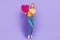 Full length cadre of optimistic girlfriend blonde hair holding huge collage pinata gift heart cookies isolated on violet