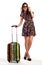 Full length of casual woman standing with travel suitcase