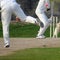 Full length of cricketer playing on field during sunny day, Cricketer on the field in action, Players playing cricket match at fie