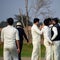 Full length of cricketer playing on field during sunny day, Cricketer on the field in action, Players playing cricket match at fie