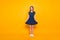 Full-length, fullbody portrait of nice, cheerful, positive, childish, comic, funny, cute girl, holding bottom of polka-dot dress