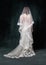 full length of joyful middle aged bride in white wedding dress