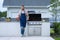 full length of man cook seafood barbecue. man cook seafood barbecue outdoor.