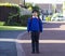 Full length outdoor portrait of preschool kid with backpack waiting for  bus, Pupil of primary going to school, Back to school