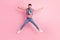 Full length photo of active cheerful young gut jump up star shape isolated on pink pastel color background