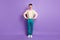 Full length photo of amazed charming young man hold hands waist wear blue trousers isolated on purple color background