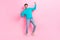 Full length photo of attractive young guy raising fists winner lottery wear trendy blue garment isolated on pink color