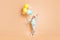 Full length photo of beautiful small lady many air balloons raise up long braid greeting best friend classmate wear blue