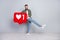 Full length photo of blogger guy hold paper heart shape dance new follow vlog isolated over grey color background